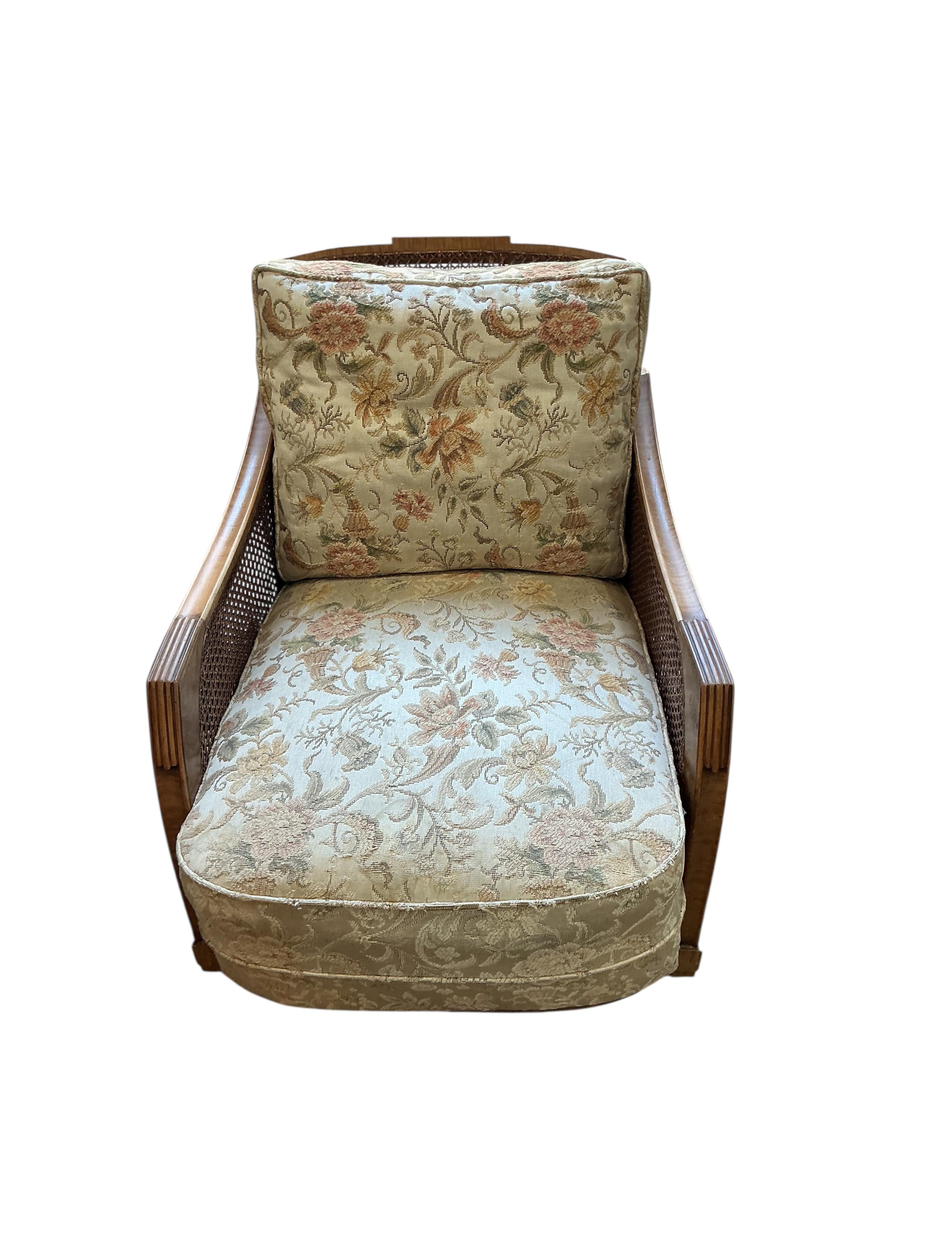 A Maple and Co. Art Deco walnut bergere armchair, width 66cm, depth 90cm, height 73cm